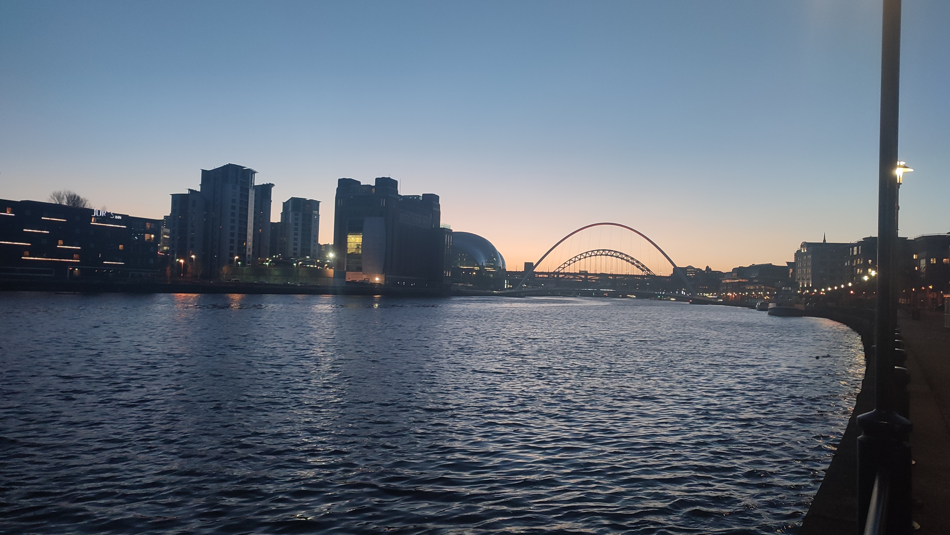 Dusk falls on the river Tyne as all five bridges which span it are seen in the background