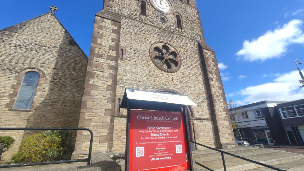 A nice old church with a red sign out front